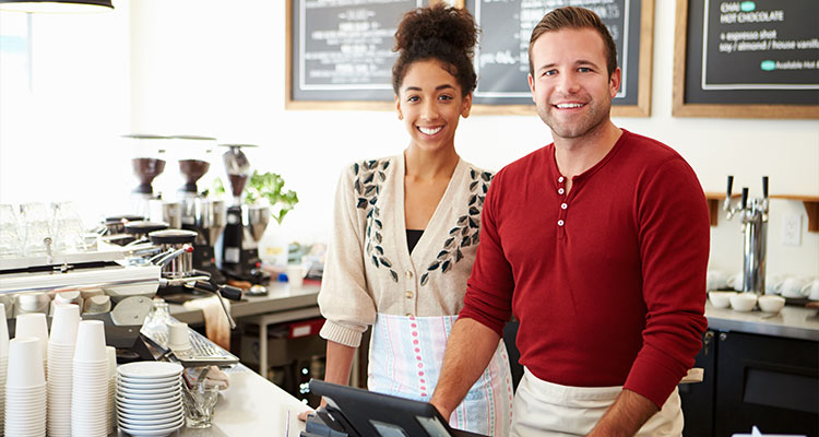 Man and woman working in coffee shop