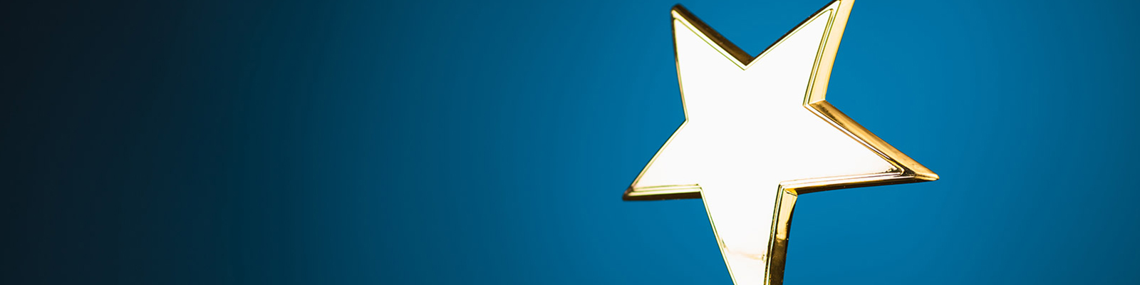 Image of a golden star with a blue background