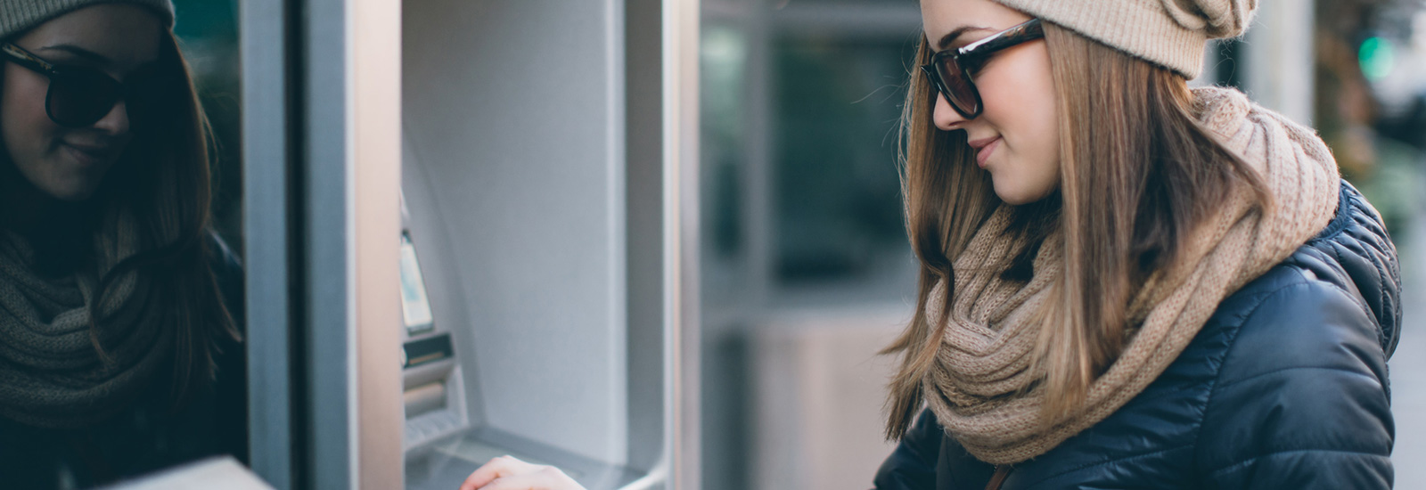 Young woman at ATM