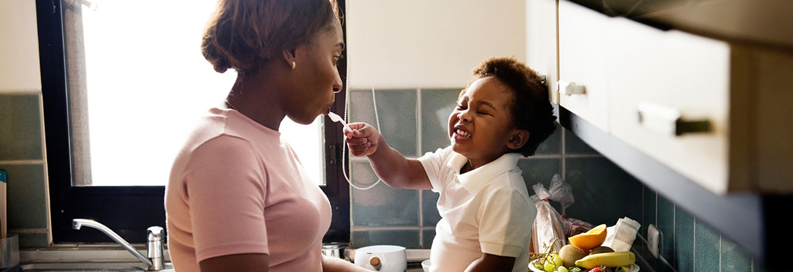 Mother and son in kitchen