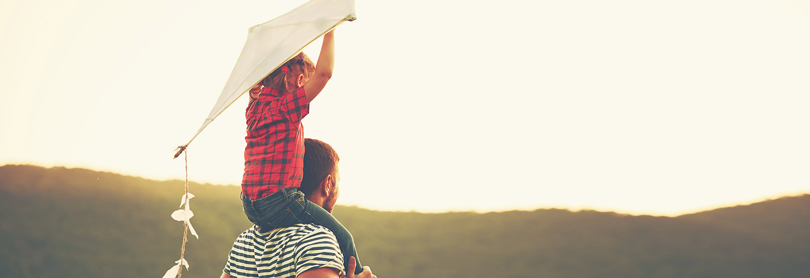 Father carrying son on his shoulders