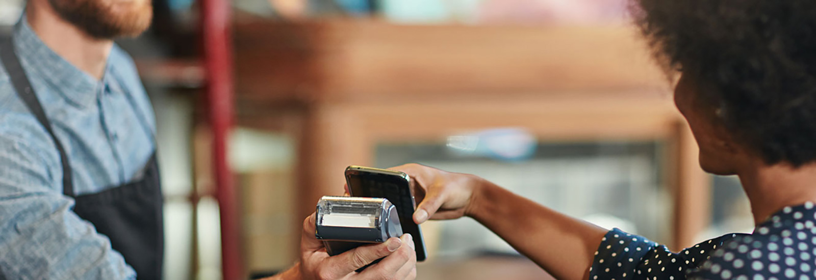 Woman paying with phone