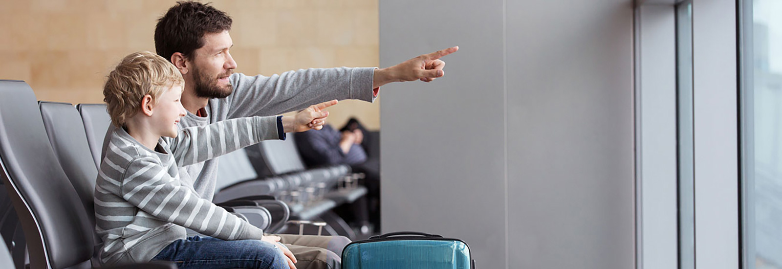 Father and son at airport