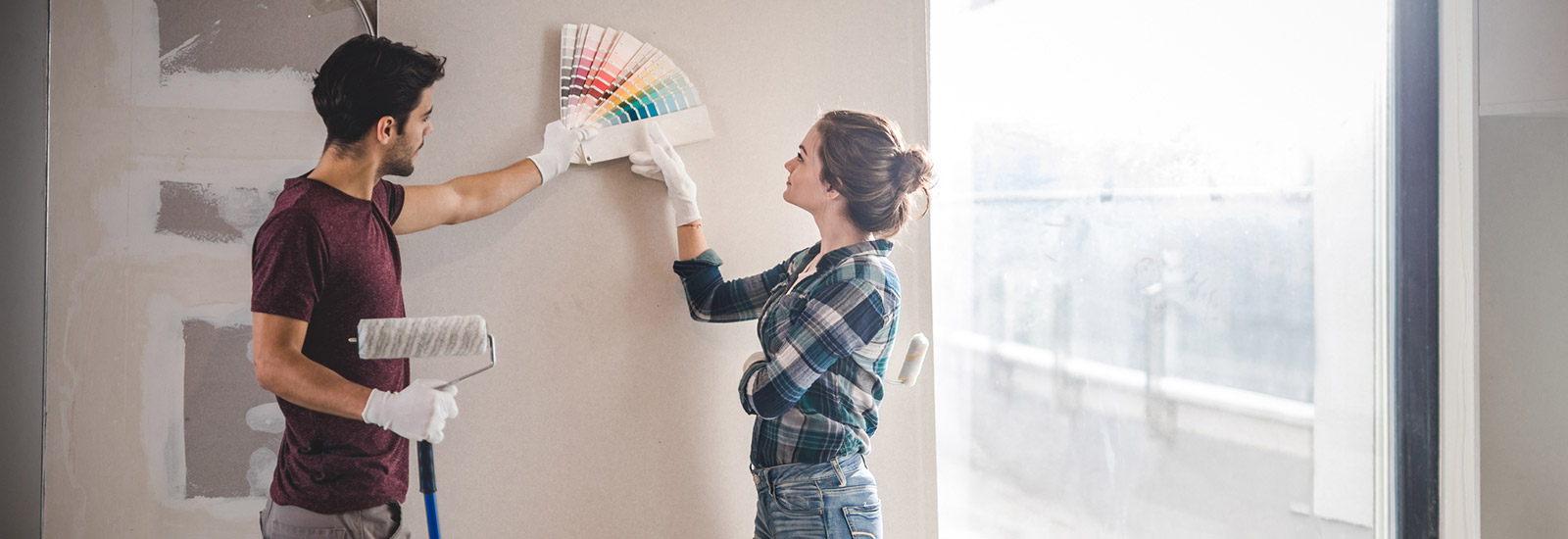 Young couple looking at paint swatches