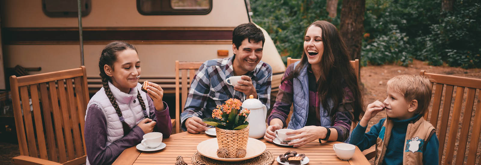 Family camping and eating outdoors