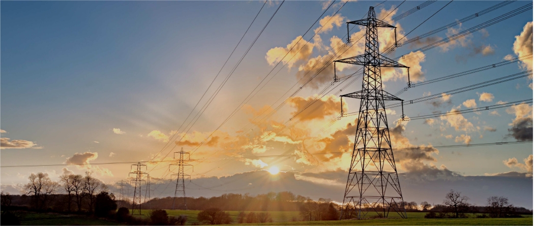 Powerlines with a sunset in the background